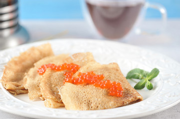 pancakes in a plate with caviar