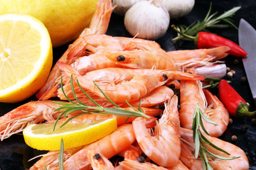 Raw fresh Prawns Langostino Austral. shrimp seafood with lemon and spices.