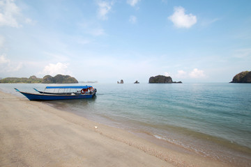 Naklejka na ściany i meble Fishing boats at the shore of Langkawi island, Malaysia