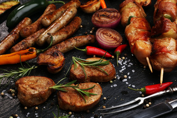 Assorted delicious grilled meat with vegetable on a barbecue