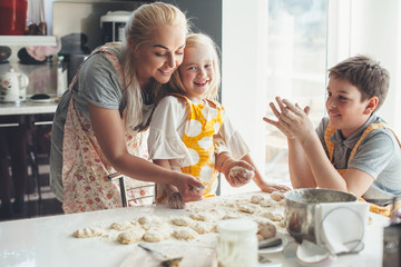 Mom cooking with kids on the kitchen