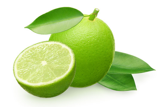 Whole fresh lime fruit with half and green leaves