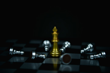 Leadership Concepts. Chess is a leader.  Comparing chess is a strategic business plan. Businessman is playing chess. Chess game on a black background.