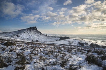 Stunning Winter sunset over snow covered Winter landscape in Peak District