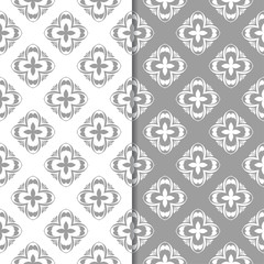 White and gray floral backgrounds. Set of seamless patterns