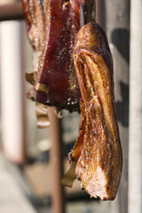 Hanging smoked domestic side.