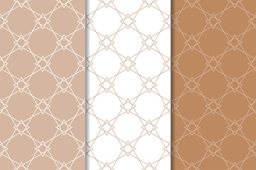 Fototapeta premium Set of geometric ornaments. Brown and white seamless patterns