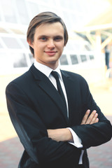 portrait of a young businessman on blurred background