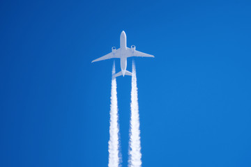 White big passenger airplane two engines aviation airport contrail clouds.