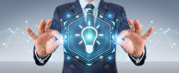 Businessman using lightbulb idea interface 3D rendering