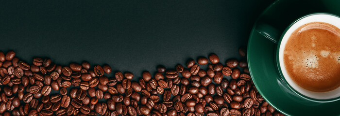 Naklejka premium strong black coffee in a mug of emerald color on a black matte background