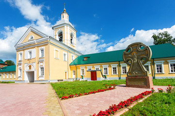 Fototapeta na wymiar Church on the gate Iverskaya and worship cross at the Holy Spirit Monastery
