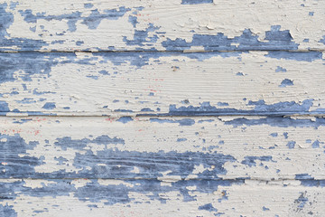 Peeling beige paint on old wooden rustic wall. Wood texture background
