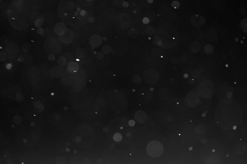 abstract dust particles over black background for overlay