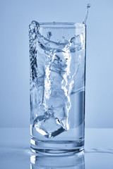 water splash in glasses isolated on white