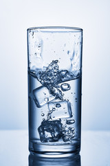 water splash in glasses isolated on white