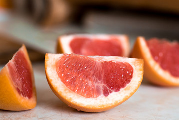 Fototapeta na wymiar Grapefruit slices closeup. Selective focus