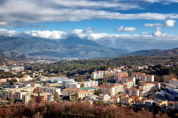 Corte, a beautiful city in the mountains on the island of Corsica, a view of the city and the mountains