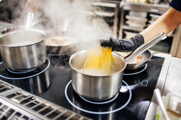 cook directs the paste into hot water