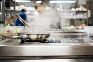 food is frying in a frying pan