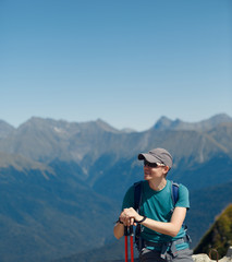 Photo of man in sunglasses with sticks