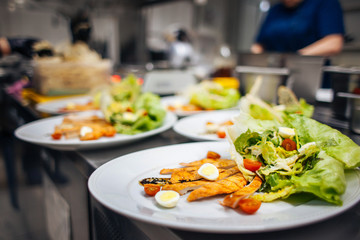fresh salad with greens, eggs, cherry tomatoes and chicken