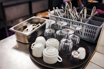 tray with wineglass and cups