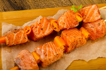 Raw salmon skewer