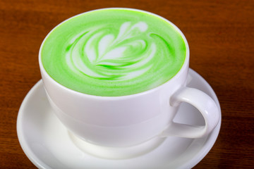 Green cappuccino with cream