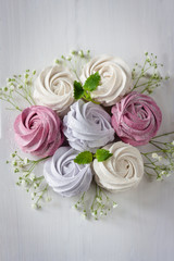 Homemade marshmallows on a light background. Russian stavberry, vanila and lavender zephyr. Selective focus. Marshmallov