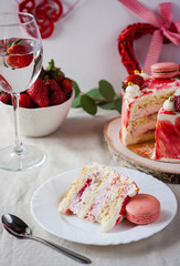 Delicious biscuit cake with strawberries on table