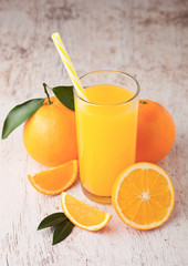 Glass of raw organic fresh orange juice with fruit