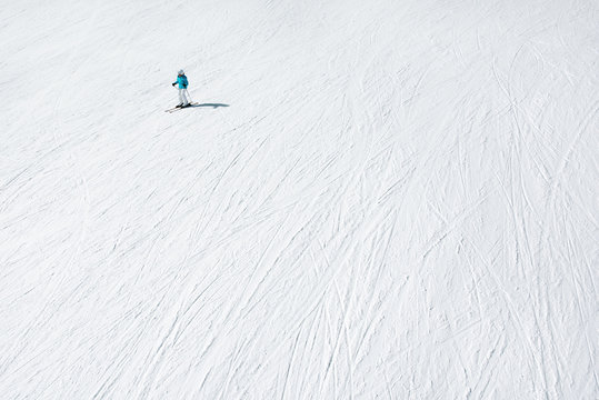 The downhill skiing. A lone skier on a snow slope