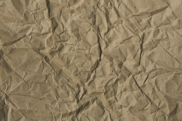 Brown rough crumpled recycled paper texture