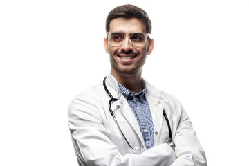Fototapeta premium Portrait of handsome man doctor standing with crossed arms isolated on white background