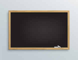 Vector black school chalkboard with chalk pieces.