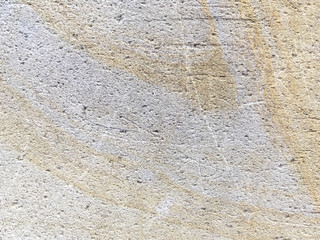 Texture of beige ancient stone, background