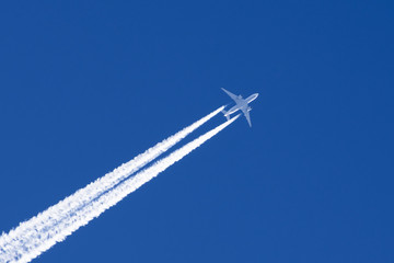 White big passenger airplane two engines aviation airport contrail clouds.