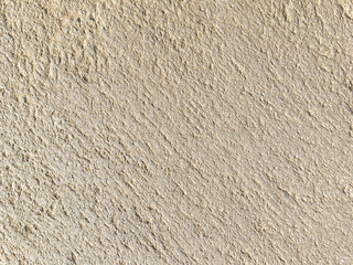 Texture of beige ancient stone, background
