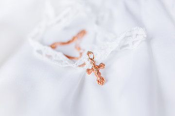 Laced dress for christening. Elegant outfit for little baby. Russian Orthodox church ceremony details.