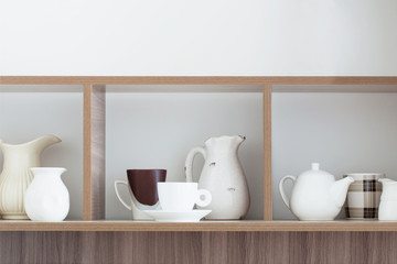 white kitchenware on wooden shelf
