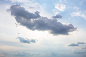 Dark clouds on  blue sky.