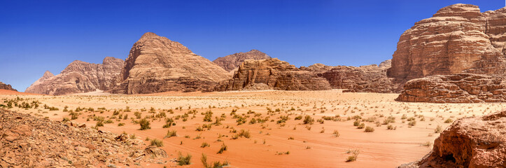 Composite panorama of high resolution aerial photos of a monolithic mountain in the central area of the desert reserve of Wadi Rum, Jordan