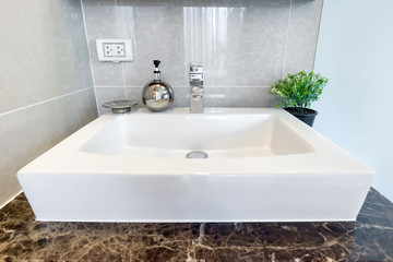 Modern wash basin sink counter with dispenser or bathroom interior contemporary