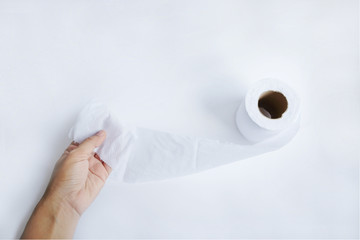 Hand holding toilet paper. isolated on white Background