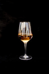 White wine glass isolated on black backgound
