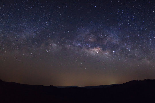 Fototapeta Starry night sky, Milky way galaxy with stars and space dust in the universe, Long exposure photograph, with grain.