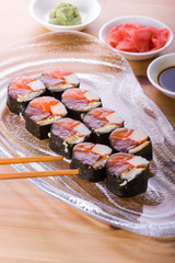 sushi roll with tuna, salmon and eel
