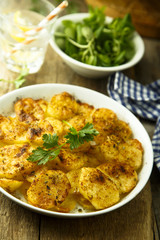 Homemade potato gratin with cheese and herbs