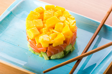 salmon tartar, avocado and mango, mix of latin and japanese food